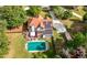 Backyard aerial view showcasing a pool, patio, solar panels, and spacious lawn at 140 Lost Forest Dr, Mcdonough, GA 30252