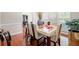 Bright dining room with large windows and a modern table setting at 140 Lost Forest Dr, Mcdonough, GA 30252