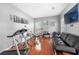 Well lit gym featuring weight machines, treadmill, and a stationary bike at 140 Lost Forest Dr, Mcdonough, GA 30252