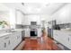 Modern kitchen with white cabinets, stainless steel appliances, and stylish backsplash at 140 Lost Forest Dr, Mcdonough, GA 30252