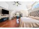 Large main bedroom with vaulted ceiling, hardwood floors, and a ceiling fan at 140 Lost Forest Dr, Mcdonough, GA 30252