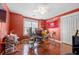 Bright home office with hardwood floors and large window for natural light at 140 Lost Forest Dr, Mcdonough, GA 30252