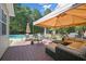 Brick patio featuring comfortable outdoor seating and a shaded area, perfect for relaxation at 140 Lost Forest Dr, Mcdonough, GA 30252