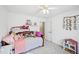 bedroom with neutral carpet, a dollhouse, and a decorative hanging plant at 4185 Cami Way, Buford, GA 30519