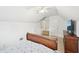 Bright bedroom featuring a bed, closet and tv with modern design, and cozy carpet at 4185 Cami Way, Buford, GA 30519