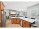 Open concept kitchen with a stone fireplace, stainless steel appliances, and an eat-in area at 4185 Cami Way, Buford, GA 30519