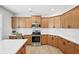 Spacious kitchen with stainless steel appliances, a large island, and granite countertops at 4185 Cami Way, Buford, GA 30519
