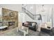 Comfortable living room showcasing a stone fireplace, staircase, and an open layout for easy entertaining at 4185 Cami Way, Buford, GA 30519