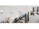 Loft area with vaulted ceiling, ceiling fan, black leather sofa, and a foosball table at 4185 Cami Way, Buford, GA 30519