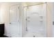 Bathroom with shower features a new surround with built in shelves at 7747 Rudder Cir, Fairburn, GA 30213