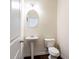 Cozy powder room featuring pedestal sink and modern fixtures at 7747 Rudder Cir, Fairburn, GA 30213