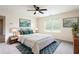 Bedroom features a ceiling fan, natural light, and calming decor at 7747 Rudder Cir, Fairburn, GA 30213