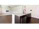 Spacious kitchen island with granite countertop and stainless steel dishwasher at 7747 Rudder Cir, Fairburn, GA 30213
