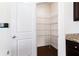Walk-in pantry with ample shelving offers generous storage space at 7747 Rudder Cir, Fairburn, GA 30213