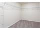 Spacious walk-in closet with wire shelving and plush carpeting at 7747 Rudder Cir, Fairburn, GA 30213