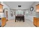 Sunlit dining area complemented by modern lighting fixtures and stylish decor at 20 Madison Ct, Covington, GA 30016