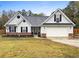 Charming single-story home features a well-manicured lawn and an attached two-car garage at 20 Madison Ct, Covington, GA 30016