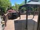 Inviting back deck featuring a gazebo, grill, and view of the beautifully landscaped yard at 2435 Jakin Way, Suwanee, GA 30024