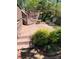 Multi-level back deck featuring stairs, a seating area, and lush landscaping at 2435 Jakin Way, Suwanee, GA 30024