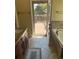 A bright bathroom with a double sink vanity, a bathtub and access to the deck at 2435 Jakin Way, Suwanee, GA 30024