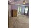 Spacious bedroom with a ceiling fan, a window, and a wooden dresser at 2435 Jakin Way, Suwanee, GA 30024