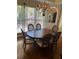 Elegant dining room featuring a chandelier and large window, perfect for gatherings at 2435 Jakin Way, Suwanee, GA 30024