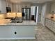 Beautiful kitchen featuring stainless steel appliances, granite countertops, and ample cabinet space at 2435 Jakin Way, Suwanee, GA 30024