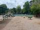 Community playground with swings, slides, and a seesaw at 2435 Jakin Way, Suwanee, GA 30024