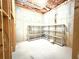 Unfinished basement with insulation, shelving, and concrete walls at 3500 Millwater Xing, Dacula, GA 30019