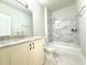 Modern bathroom featuring marble floors, marble tiled walls, and a bath and shower at 3500 Millwater Xing, Dacula, GA 30019