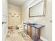 Modern bathroom with an above counter vessel sink and open shower at 3500 Millwater Xing, Dacula, GA 30019