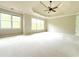 Large main bedroom with tray ceiling and lots of natural light from large windows at 3500 Millwater Xing, Dacula, GA 30019