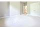 This is a carpeted bedroom with a closet with white double doors and access to the hallway at 3500 Millwater Xing, Dacula, GA 30019