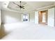 Spacious bedroom with tray ceiling, crown molding, and multiple entryways at 3500 Millwater Xing, Dacula, GA 30019