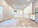 Large bonus room with tile flooring, multiple windows, and convenient kitchenette at 3500 Millwater Xing, Dacula, GA 30019
