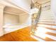 Foyer featuring hardwood and carpet flooring, staircase with decorative railings, and an open floor plan at 3500 Millwater Xing, Dacula, GA 30019
