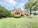 Beautiful brick home with manicured landscaping, a two-car garage, and a welcoming front porch at 3500 Millwater Xing, Dacula, GA 30019