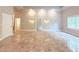 Open living room features large tile flooring and bright white walls at 3500 Millwater Xing, Dacula, GA 30019