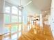 Open living room with soaring ceilings, large windows, and hardwood floors at 3500 Millwater Xing, Dacula, GA 30019