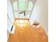 Spacious living room featuring hardwood floors, a fireplace, and large windows at 3500 Millwater Xing, Dacula, GA 30019