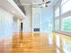Open concept living room with fireplace, high ceilings, and large windows at 3500 Millwater Xing, Dacula, GA 30019