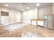 Bright living space with tiled floors, mini-kitchen, and stainless steel fridge at 3500 Millwater Xing, Dacula, GA 30019