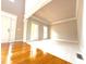 Bright living room with hardwood floors, neutral paint, and large windows that flood the space with natural light at 3500 Millwater Xing, Dacula, GA 30019