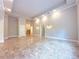 Spacious living area featuring unique tile floor, high ceilings, and arched entryway at 3500 Millwater Xing, Dacula, GA 30019