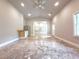 Bright living space with tiled floors, mini-kitchen, and view to entry at 3500 Millwater Xing, Dacula, GA 30019