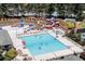 Aerial view of resort-style community pool with water slides and splash pad area at 3500 Millwater Xing, Dacula, GA 30019
