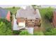 Aerial view of the rear of a red brick home featuring a deck and brick chimney at 3500 Millwater Xing, Dacula, GA 30019