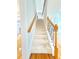 Carpeted staircase with an ornate wrought iron railing leading to the upper level of the home at 3500 Millwater Xing, Dacula, GA 30019