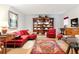 Finished basement with bookshelves, red accent chairs, and cozy seating area at 4705 Paran Nw Vly, Atlanta, GA 30327