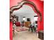 Finished basement with decorative archway, red accent wall, and cozy living space at 4705 Paran Nw Vly, Atlanta, GA 30327